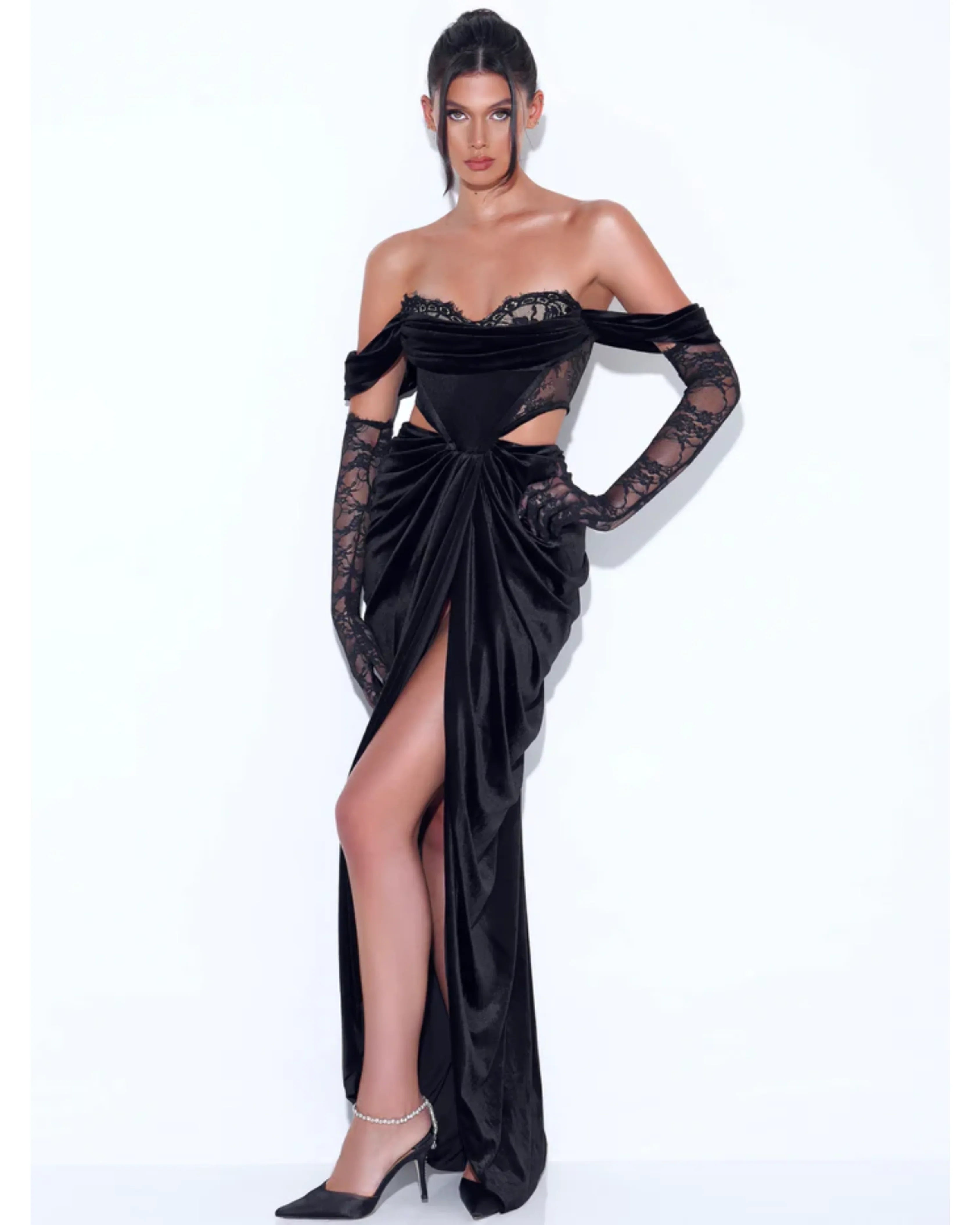 Elegant black velvet gown with lace corset bodice, off-shoulder sleeves, cutout waist, draped skirt and high slit — Miss Circle | Endless UAE