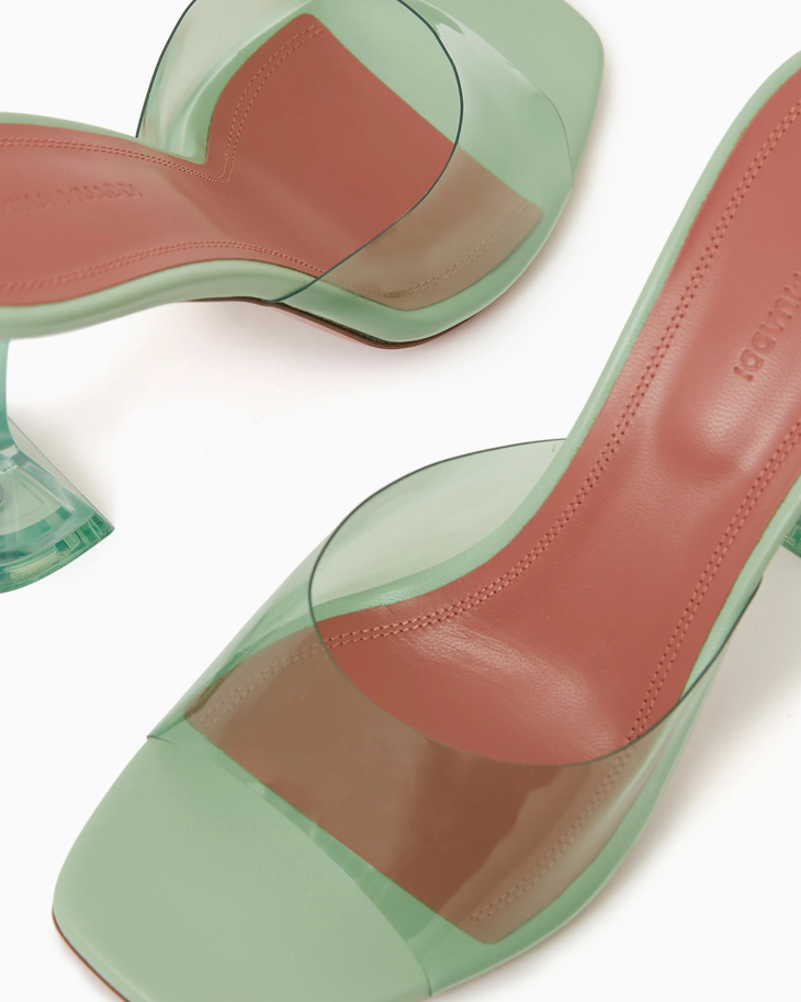 Lupita 95 Mules in translucent green PVC with sculptural heel — Amina Muaddi | Endless UAE