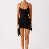 Black halter mini dress with asymmetric hem and beaded straps — Peppermayo | Endless UAE