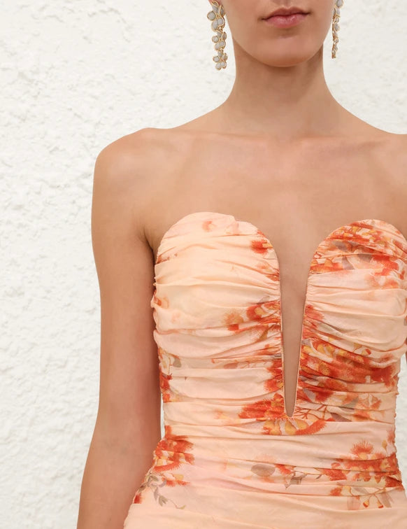 Strapless midi dress with ruched bodice and orange floral print on peach fabric — Zimmermann | Endless UAE