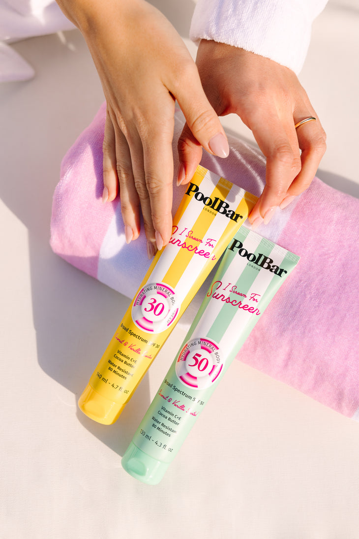 Yellow tube of PoolBar London SPF 30 mineral sunscreen with pink circular badge and striped design — PoolBar London | Endless UAE