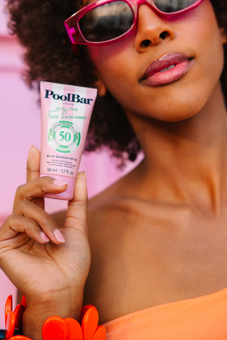 Pink tube of PoolBar London SPF 50 face sunscreen with hydrating mineral formula and blue light protection — PoolBar London | Endless UAE
