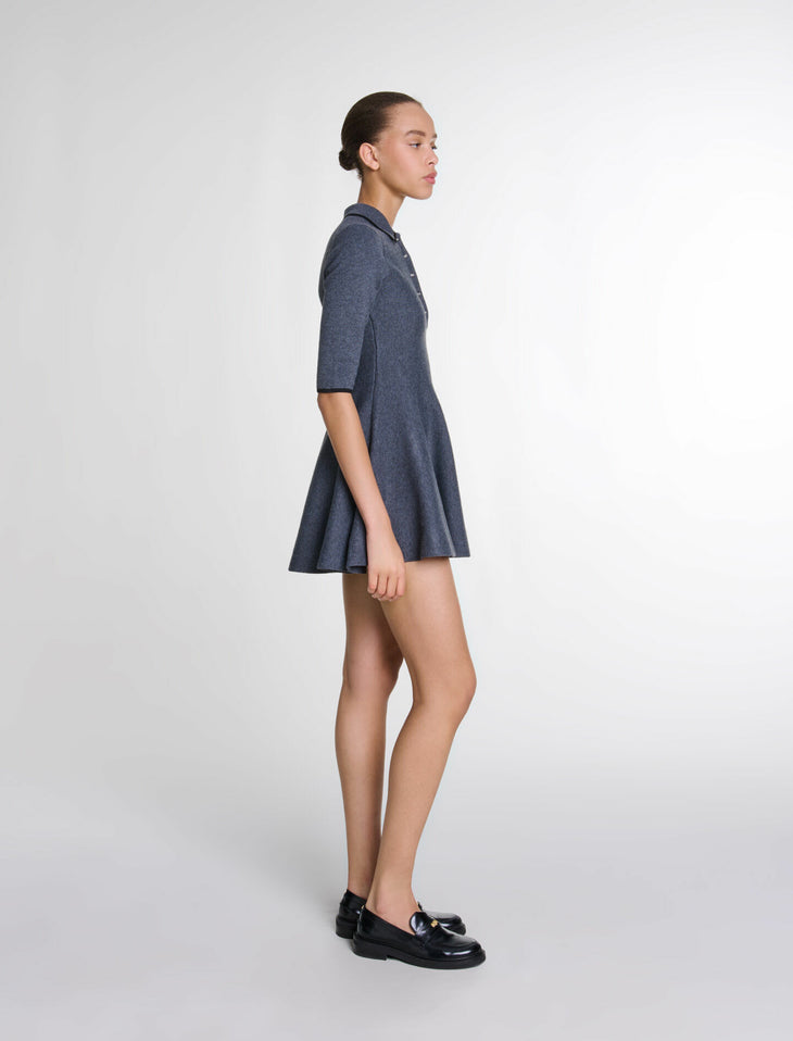 Woman wearing navy blue short knit dress with collar and three-quarter sleeves, side profile view — Maje | Endless UAE