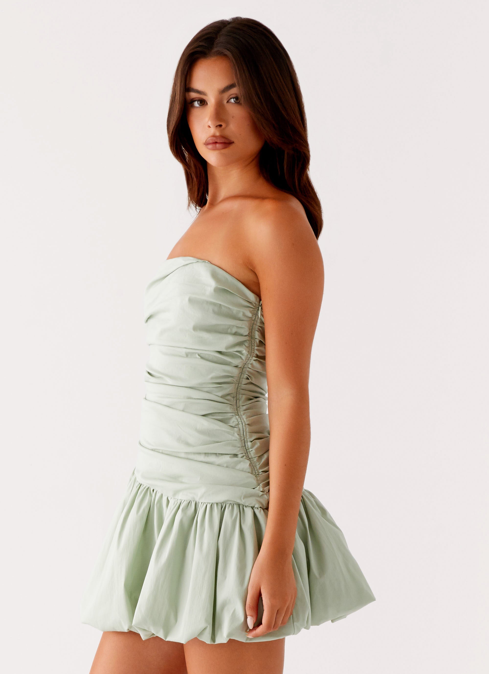Sage green strapless bubble mini dress with ruched detailing and scalloped hem — Peppermayo | Endless UAE