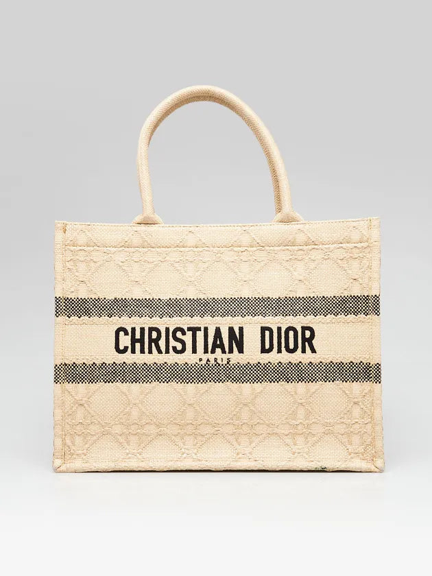 Natural woven straw tote bag with black striped detail, Christian Dior Paris branding, and quilted cannage pattern — Dior | Endless UAE