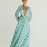 Woman wearing a flowing light blue wrap dress with long sleeves and cutout waist detail — Anne Louise Boutique | Endless UAE