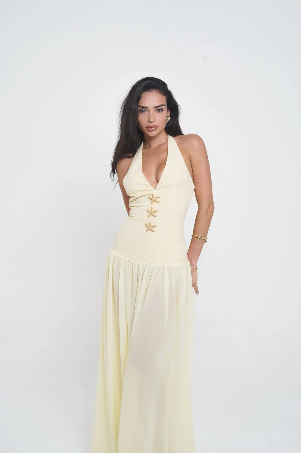 Elegant pale yellow halter maxi dress with starfish embellishments and plunging neckline — Vivienne Collection | Endless UAE