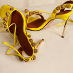 Bright yellow strappy high heel sandals with gold embellished details along the straps — Subashini Heels | Endless UAE