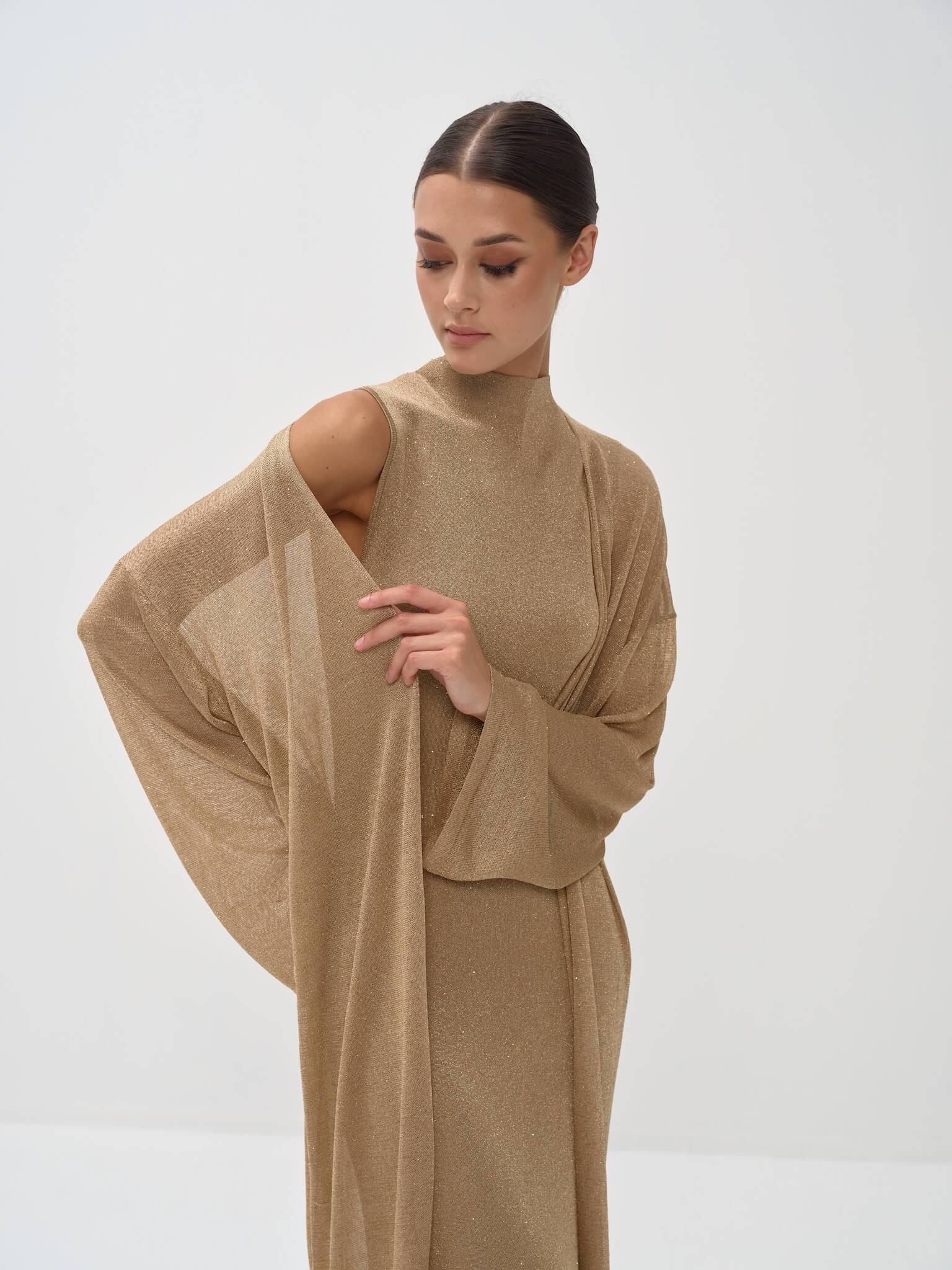 Elegant gold shimmer dress set with mock neck top and flowing wide-leg pants with draped sleeves — Nora The Label | Endless UAE