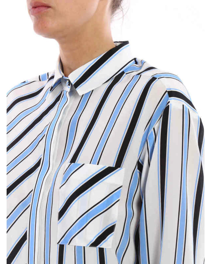 Striped silk shirt with blue, black and white diagonal stripes paired with dark blue jeans — M.S.G.M | Endless UAE