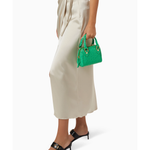 Green crocodile-embossed mini tote bag with gold hardware held by hand — By Far | Endless UAE