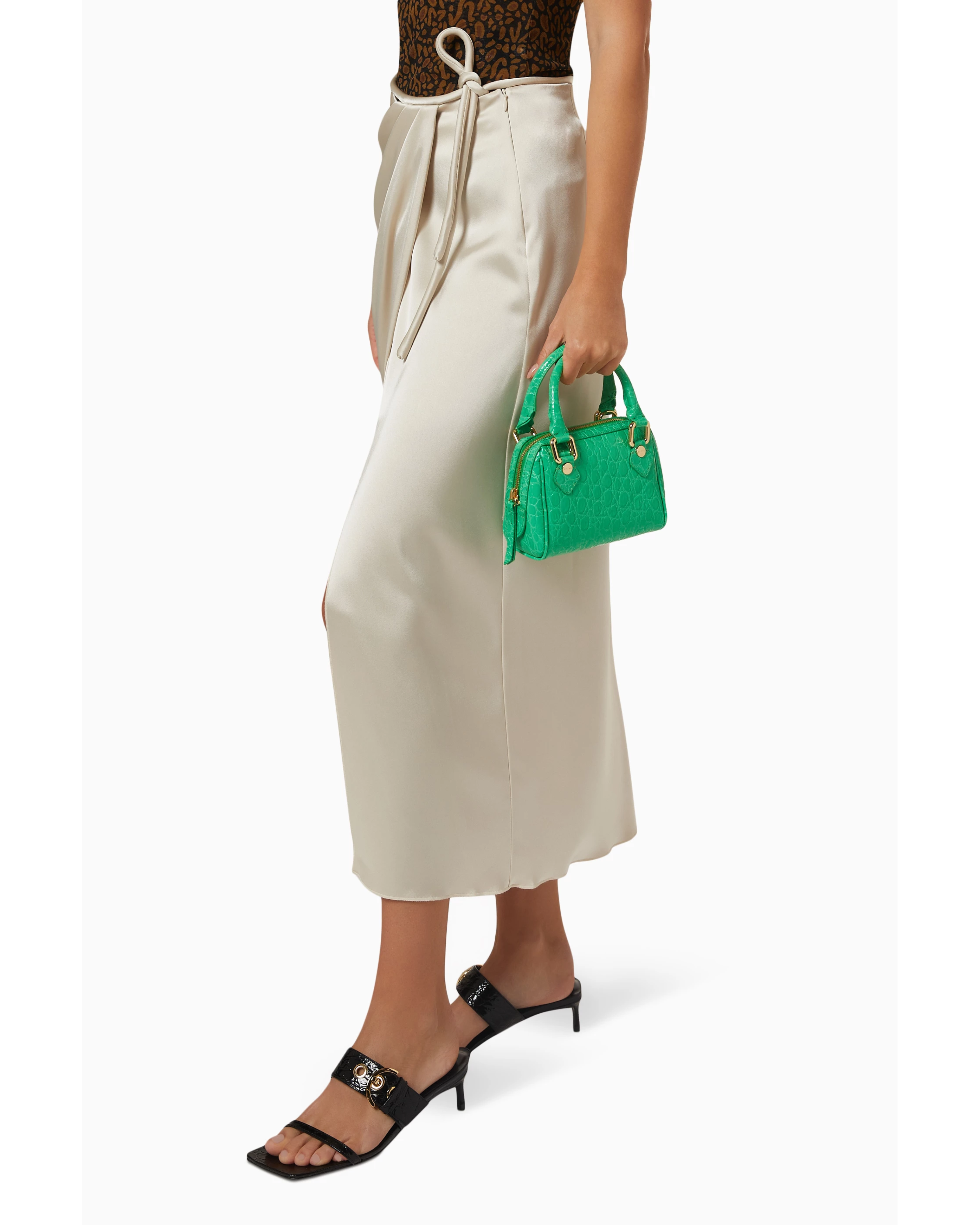 Green crocodile-embossed mini tote bag with gold hardware held by hand — By Far | Endless UAE