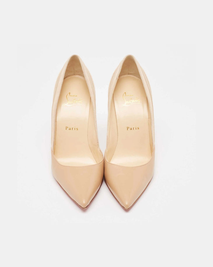 Nude patent leather pointed-toe pumps with signature red sole, viewed from above — Christian Louboutin | Endless UAE