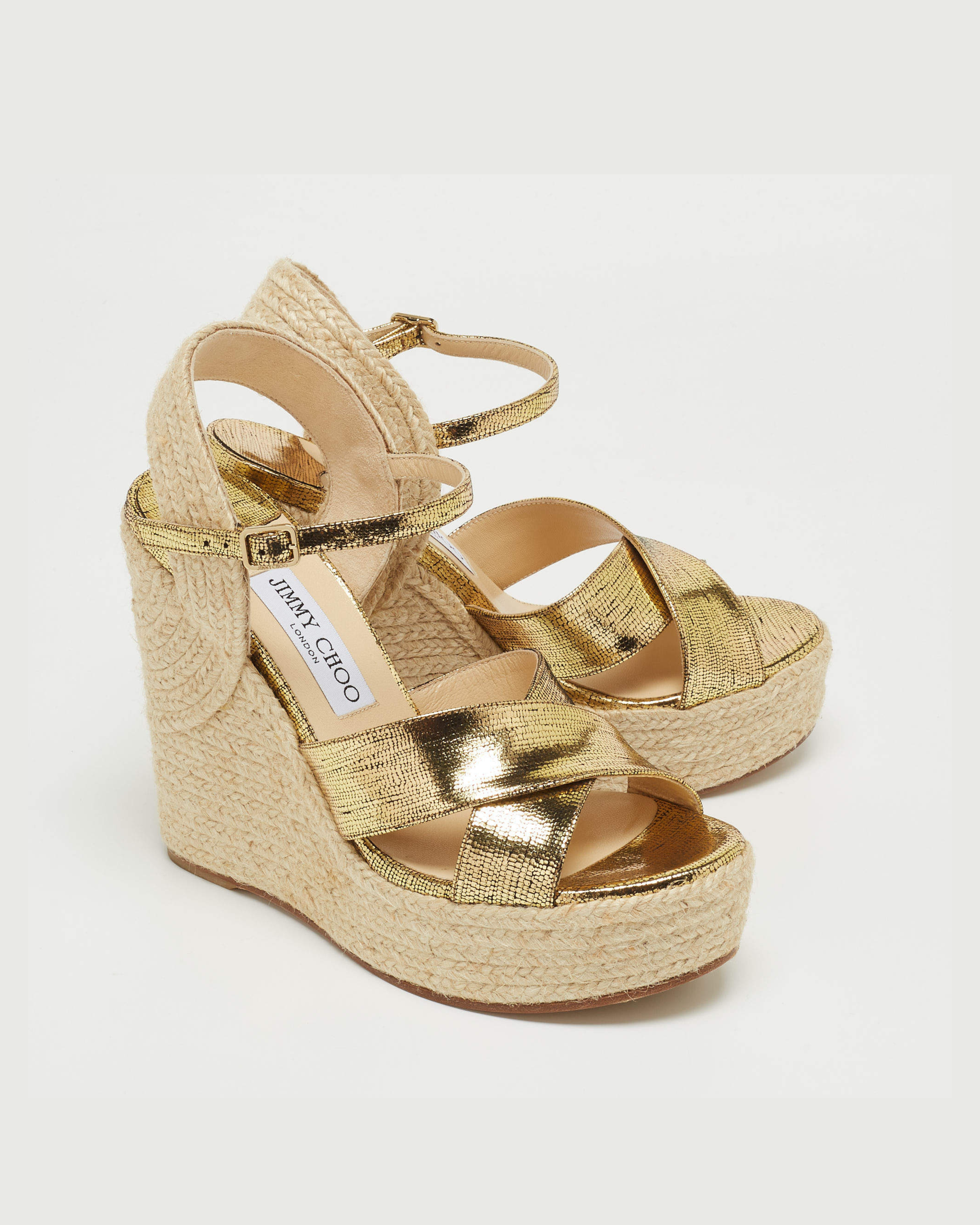 Gold metallic espadrille wedge sandals with crisscross straps and ankle buckle on beige jute platform — Jimmy Choo | Endless UAE