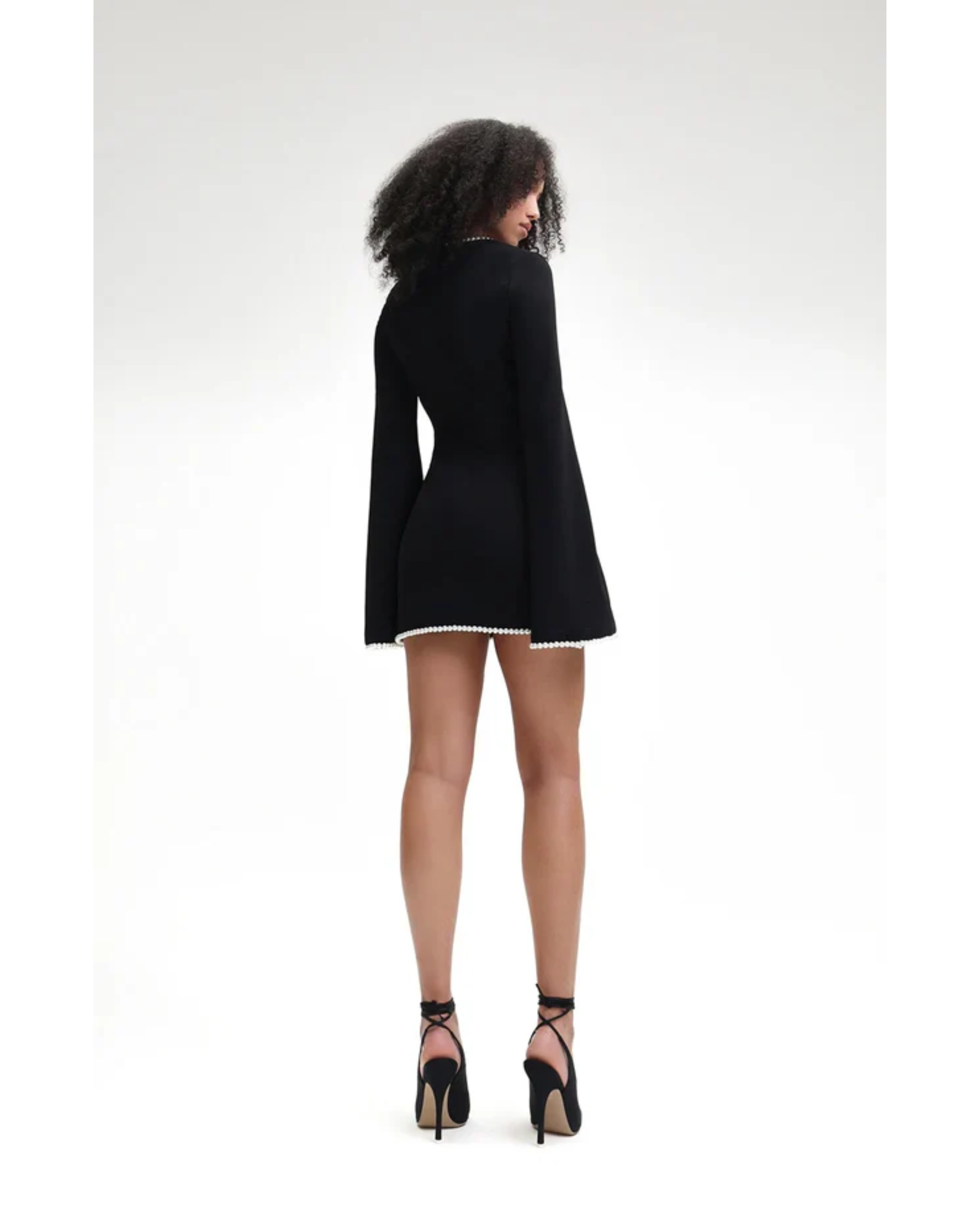 Black V-neck mini dress with pearl trim and bell sleeves — Khanum's | Endless UAE