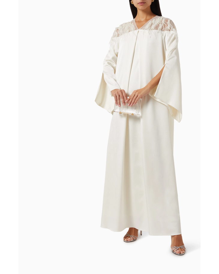 Elegant ivory maxi dress with lace yoke detail and dramatic wide cape sleeves — Nass | Endless UAE
