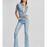 Woman wearing light blue denim Fallon Jumpsuit with short sleeves and flared legs — SER.O.YA | Endless UAE