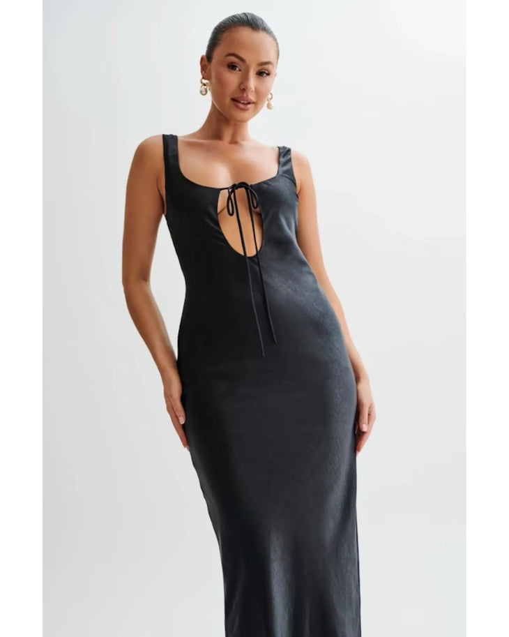 Woman wearing black satin maxi dress with keyhole neckline and tie detail — Meshki | Endless UAE