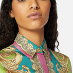 Woman wearing Barocco Goddess silk shirt in yellow with baroque print and colorful placket — Versace | Endless UAE