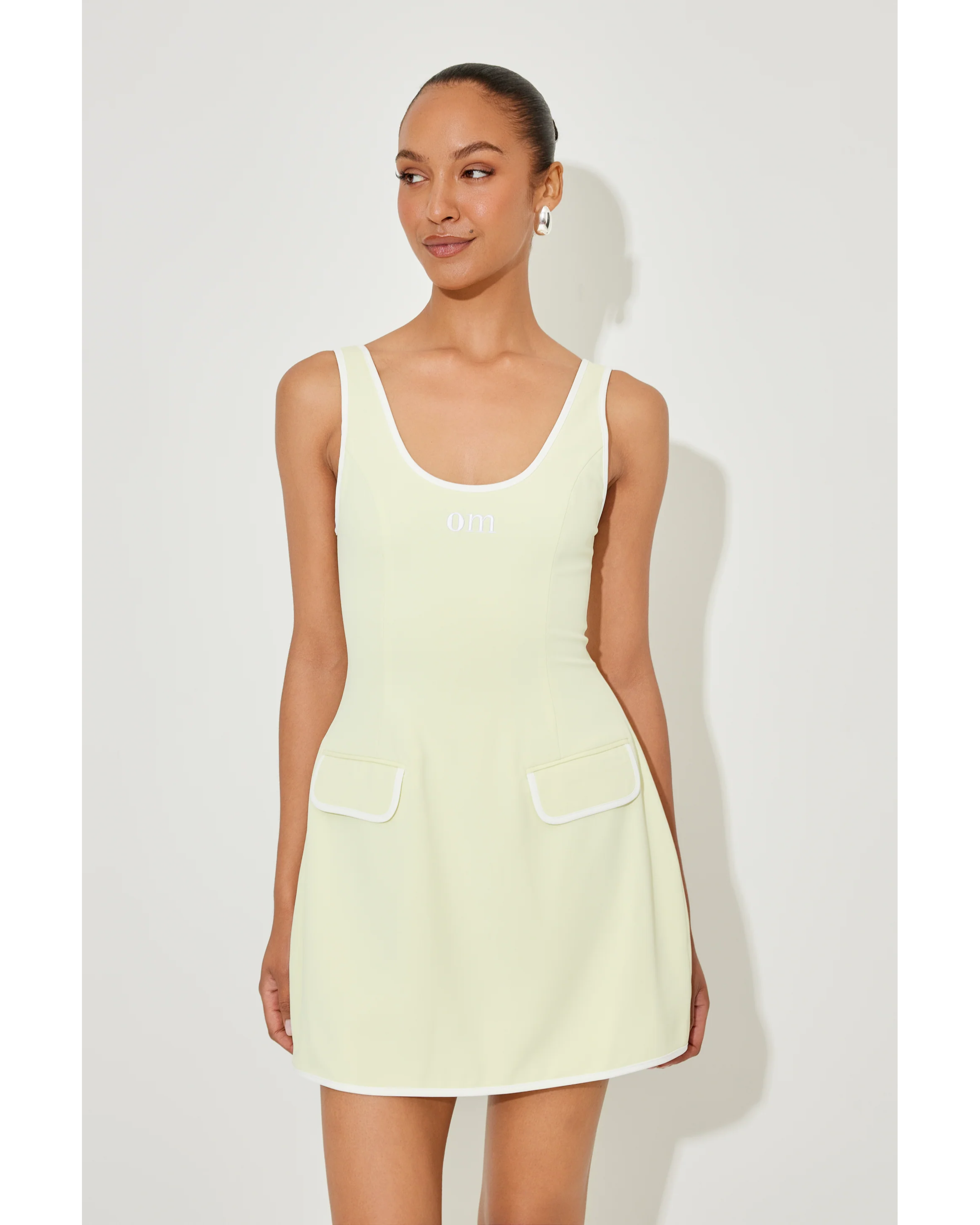 Cream sleeveless tennis dress with front pockets and scoop neckline — Odd Muse | Endless UAE