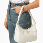 White Saffiano leather mini shoulder bag with gold-tone triangular logo and adjustable strap — Prada | Endless UAE