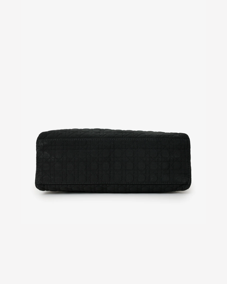 Black quilted nylon Lady Dior bag with cannage pattern shown from bottom view on white background — Dior | Endless UAE