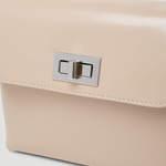 Beige patent leather shoulder bag with dual compartments and silver turnlock closures — Endless | Endless UAE