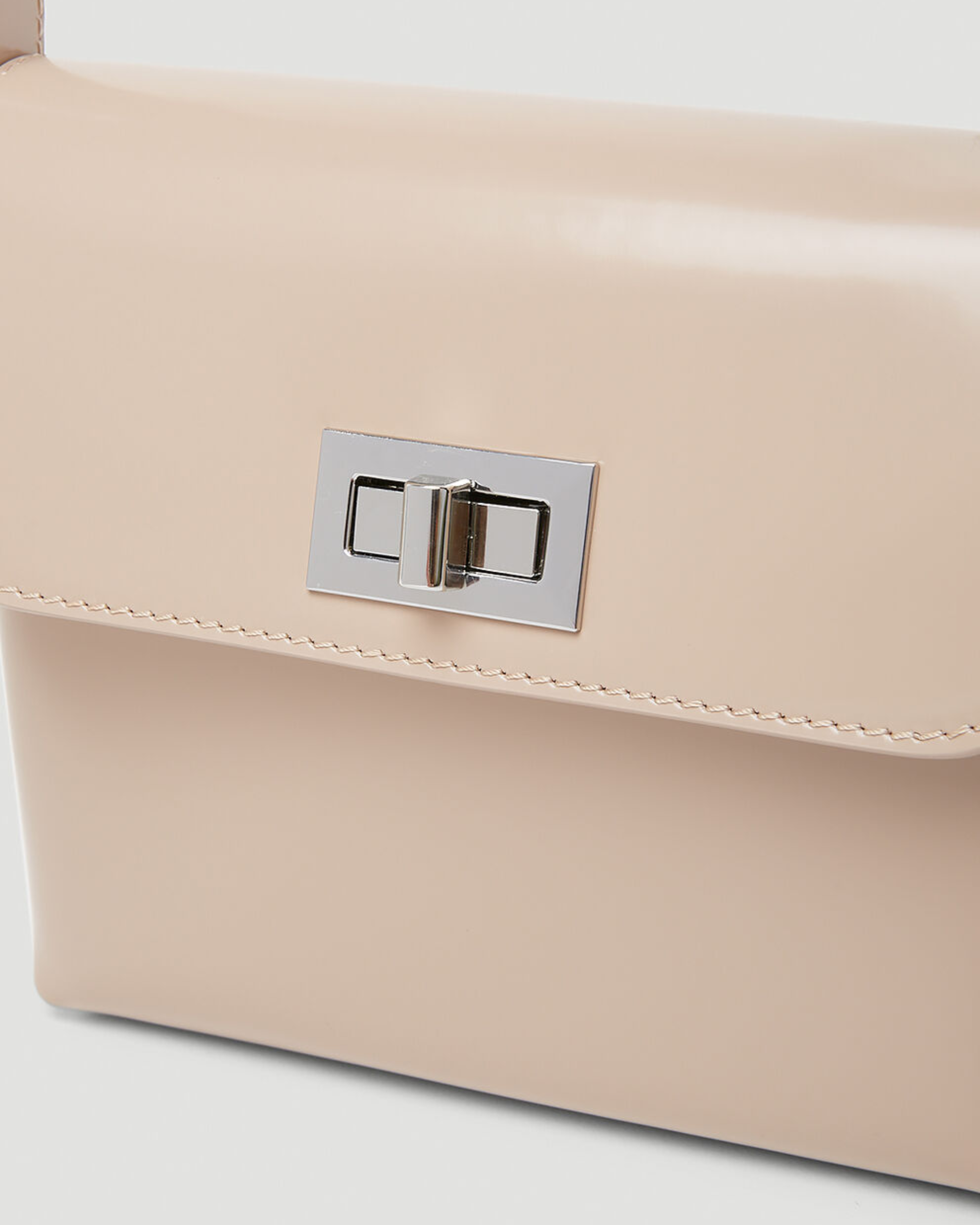 Beige patent leather shoulder bag with dual compartments and silver turnlock closures — Endless | Endless UAE