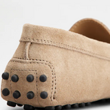 Beige suede junior driving loafer with black rubber sole and stitched detailing — Tod's | Endless UAE