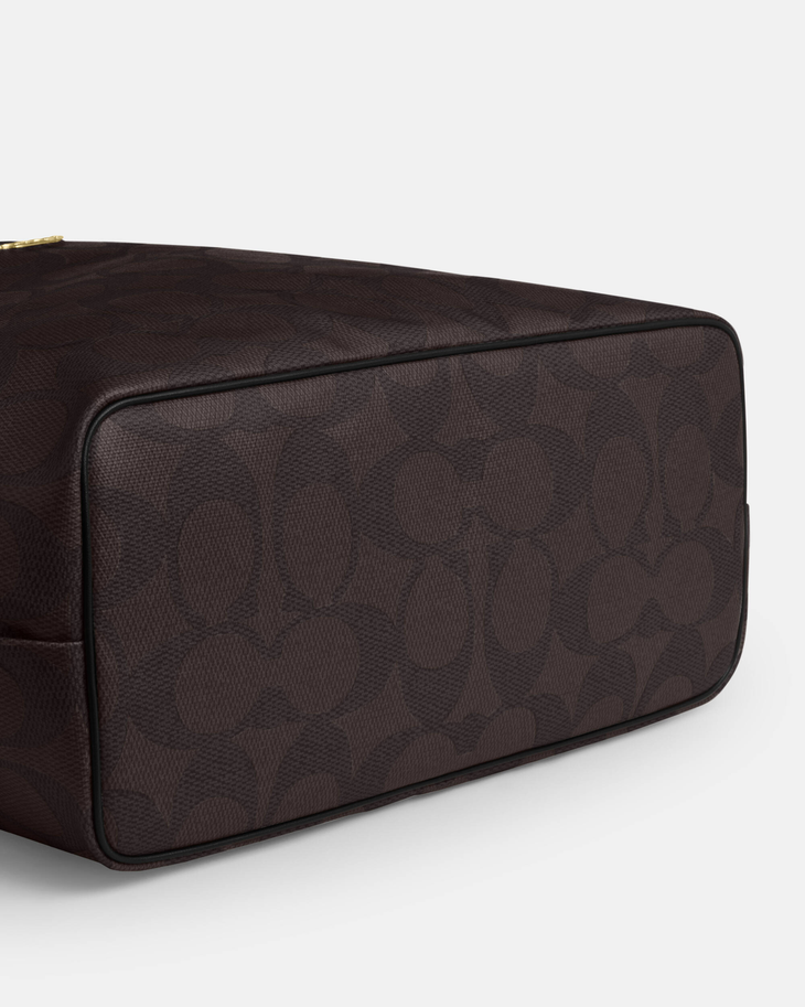 Black leather tote bag with dual handles and Coach branding — Coach | Endless UAE