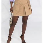 Beige cotton mini skirt with gold logo plaque at waist, cargo pockets with button details, and pleated hem — Elisabetta Franchi | Endless UAE