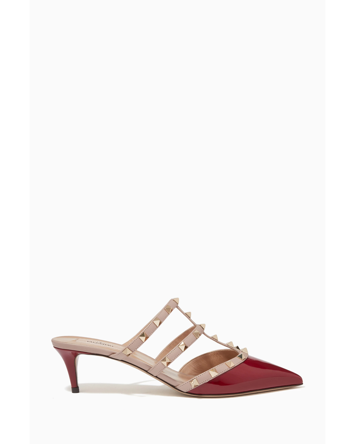Rockstud Mules in red and beige leather with signature pyramid studs — Valentino Garavani | Endless UAE