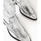 Silver crackled leather western-style cowboy boot with black heel and decorative stitching — Schutz | Endless UAE