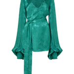 Woman wearing emerald green Harlequin Dress with palm print and flowing sleeves — Rat & Boa | Endless UAE