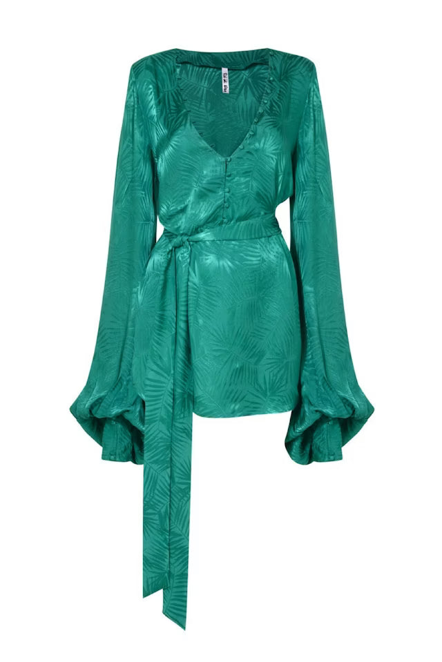 Woman wearing emerald green Harlequin Dress with palm print and flowing sleeves — Rat & Boa | Endless UAE