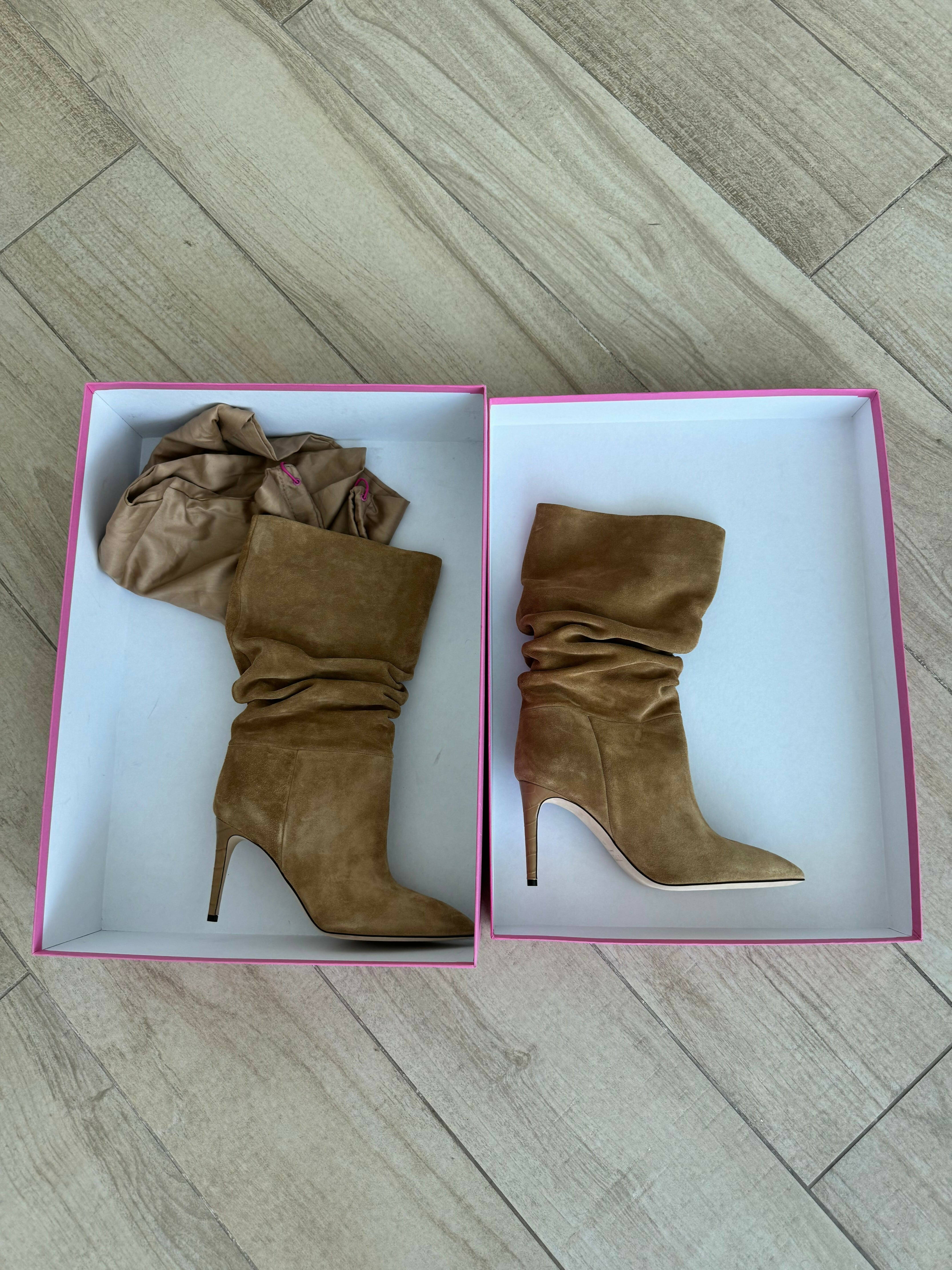 Camel velour slouchy knee-high boots with pointed toe and stiletto heel displayed in pink boxes on wooden floor — Paris Texas | Endless UAE