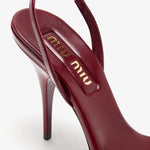 Burgundy patent leather sandal with thin straps and high stiletto heel — Miu Miu | Endless UAE