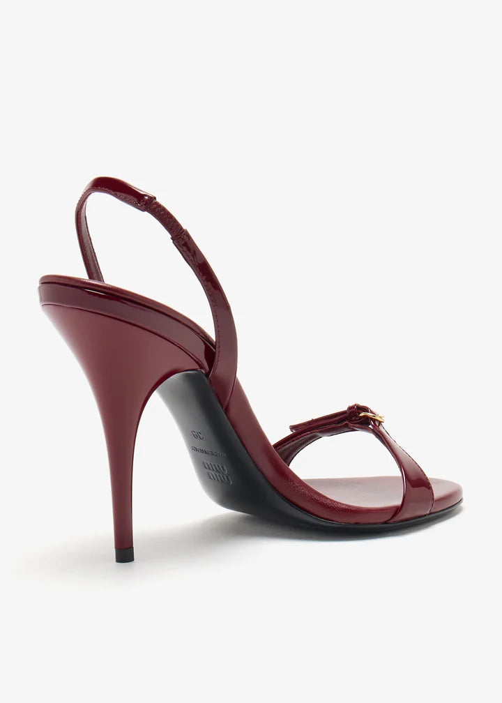 Burgundy patent leather sandal with thin straps and high stiletto heel — Miu Miu | Endless UAE
