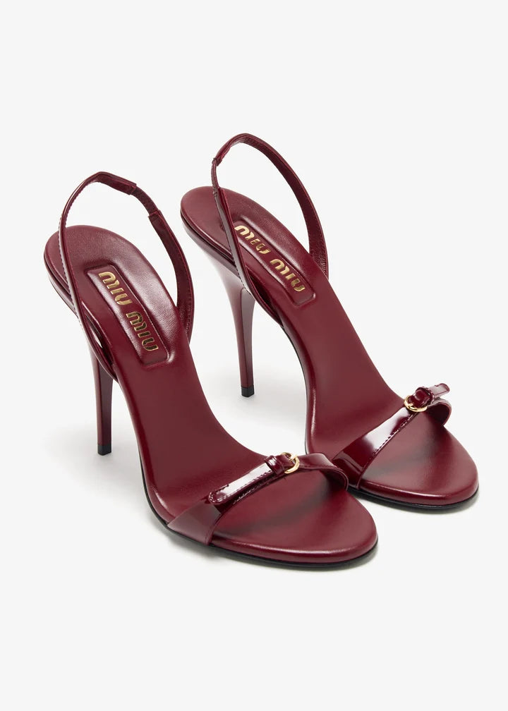Burgundy patent leather sandal with thin straps and high stiletto heel — Miu Miu | Endless UAE