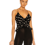 Black polka dot cami top with thin straps and V-neckline worn with sheer black pants — Khaite | Endless UAE