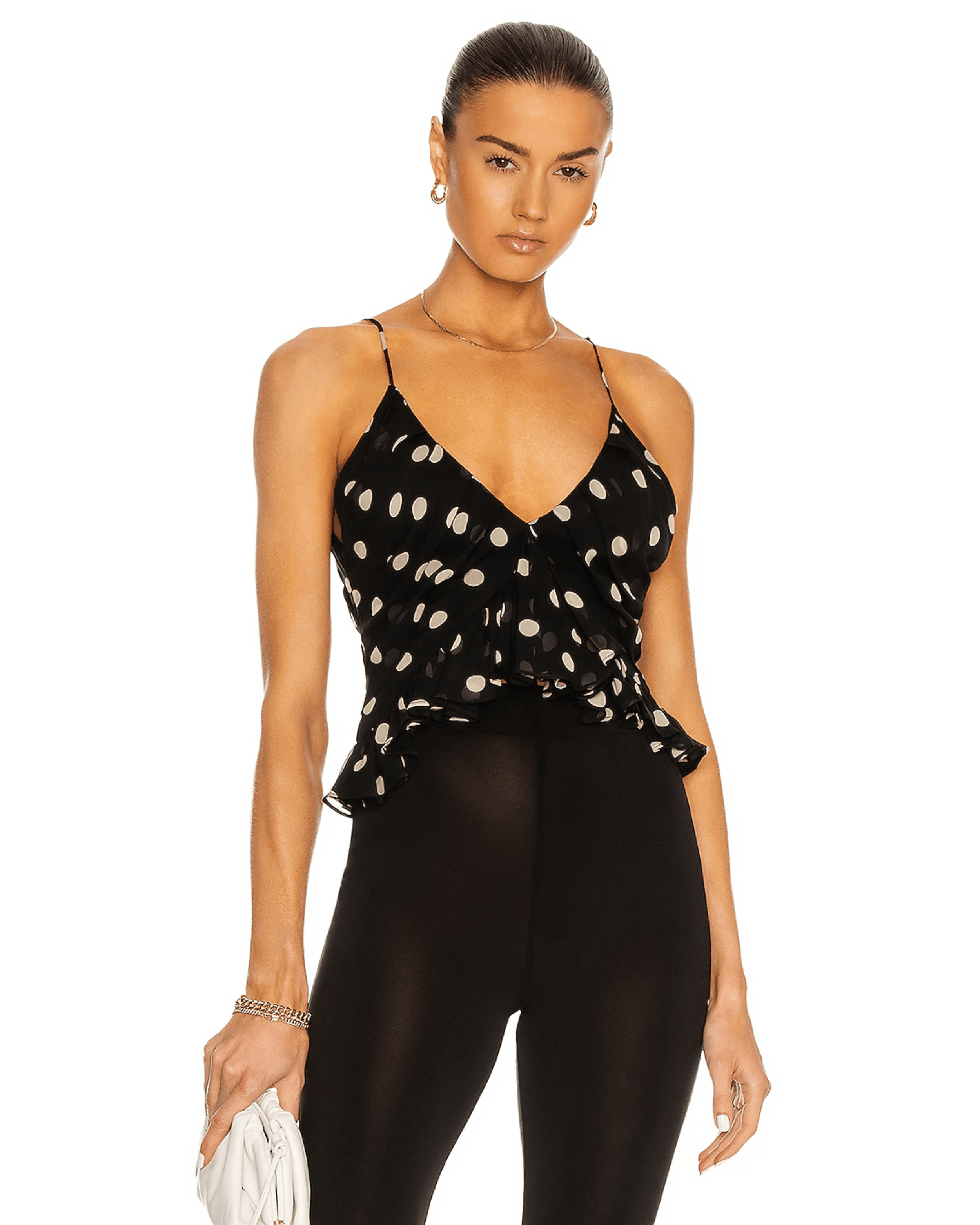 Black polka dot cami top with thin straps and V-neckline worn with sheer black pants — Khaite | Endless UAE