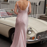 Elegant pale pink scoop back maxi dress with flowing silhouette, photographed beside vintage car — By Keara | Endless UAE