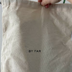 Dulce Patent Leather Shoulder Bag in vibrant green, held up against neutral background — By Far | Endless UAE