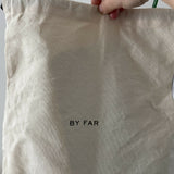 Dulce Patent Leather Shoulder Bag in vibrant green, held up against neutral background — By Far | Endless UAE