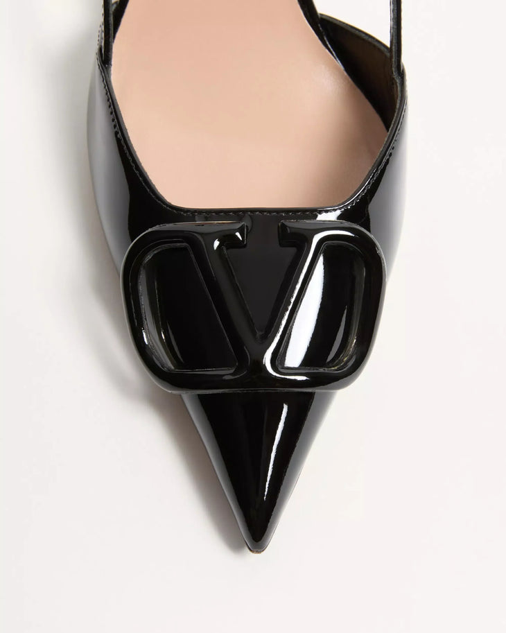 Black patent leather pointed toe slingback pump with oversized VLogo hardware embellishment — Valentino Garavani | Endless UAE