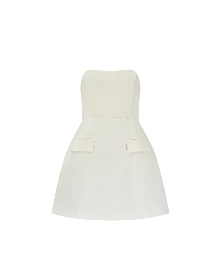 Woman wearing a white strapless dress with pockets and a flared skirt — Odd Muse | Endless UAE