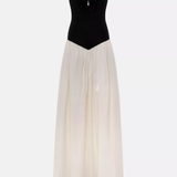 Woman wearing black and white off-shoulder Parisienne Maxi Dress in ornate palace room — Lichi | Endless UAE