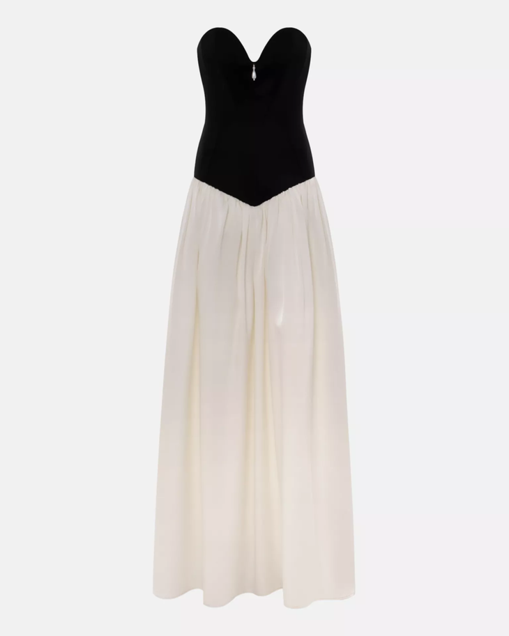 Woman wearing black and white off-shoulder Parisienne Maxi Dress in ornate palace room — Lichi | Endless UAE