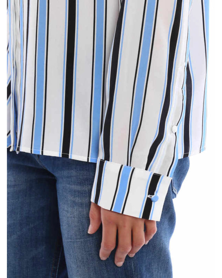 Striped silk shirt with blue, black and white diagonal stripes paired with dark blue jeans — M.S.G.M | Endless UAE