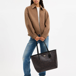 Black leather tote bag with dual handles and Coach branding — Coach | Endless UAE